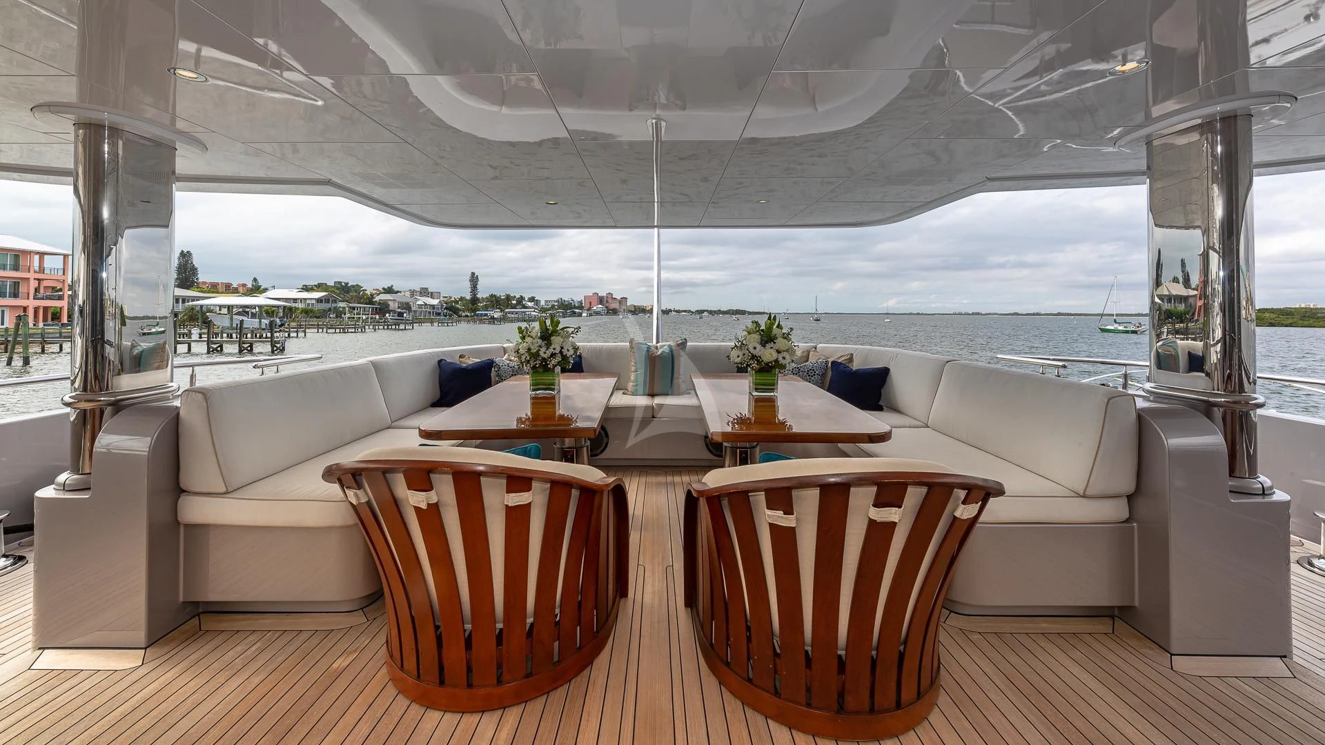 a room with a couch and a table and chairs aboard STARSHIP Yacht for Charter