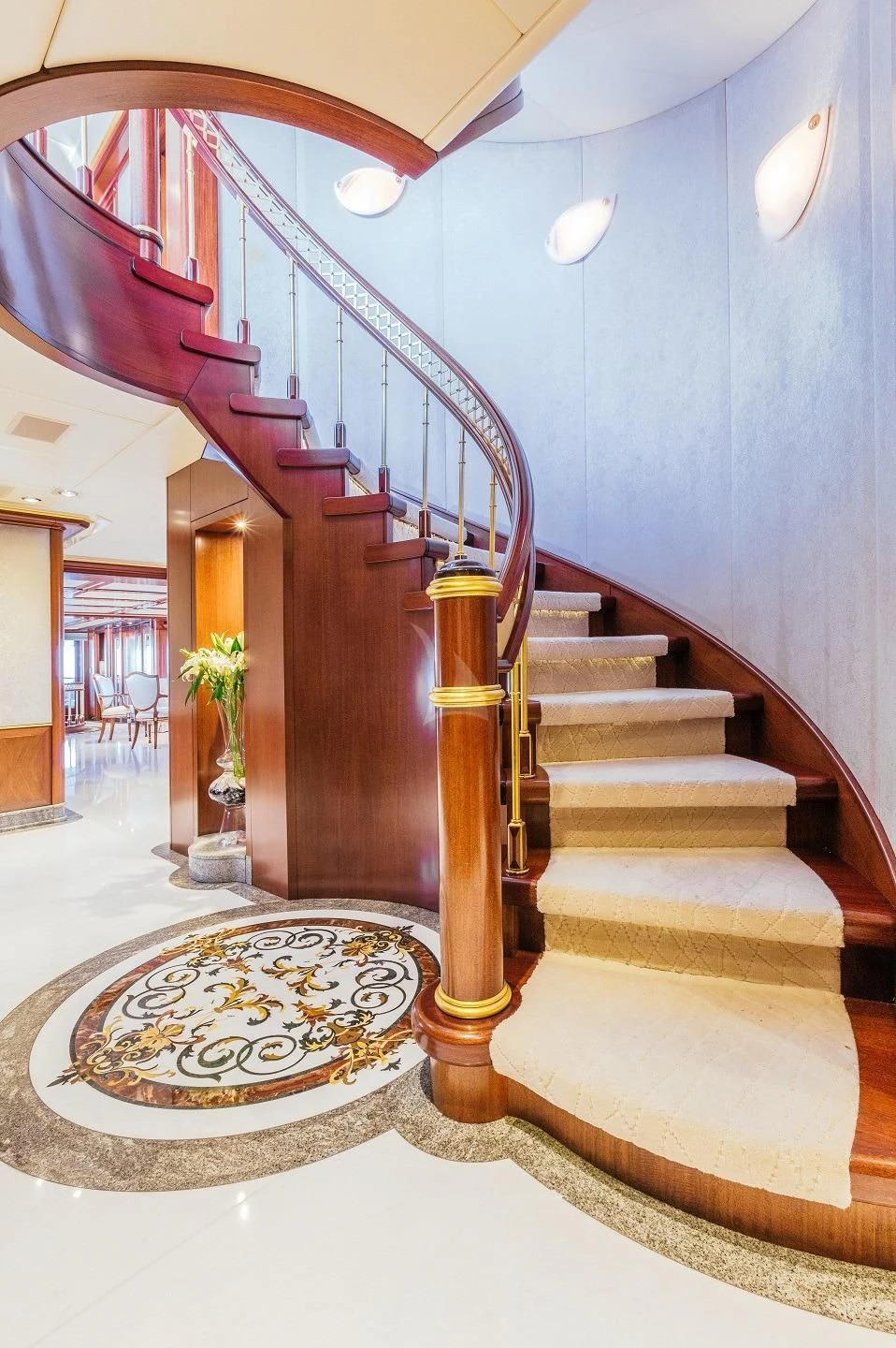 a staircase with a rug aboard STARSHIP Yacht for Charter