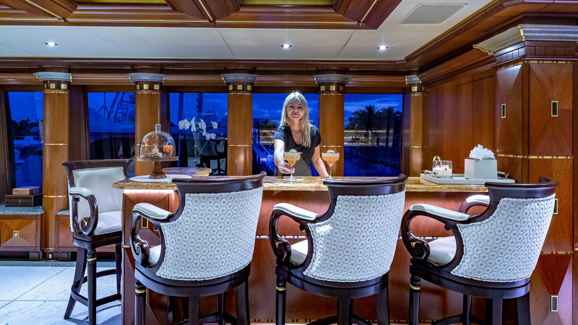 a person sitting at a table aboard STARSHIP Yacht for Charter