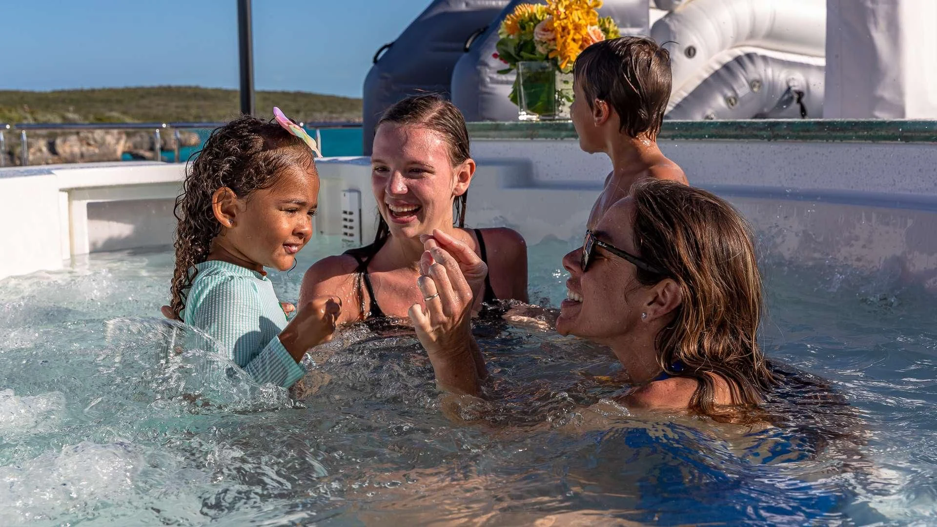 a group of people in a pool aboard STARSHIP Yacht for Charter