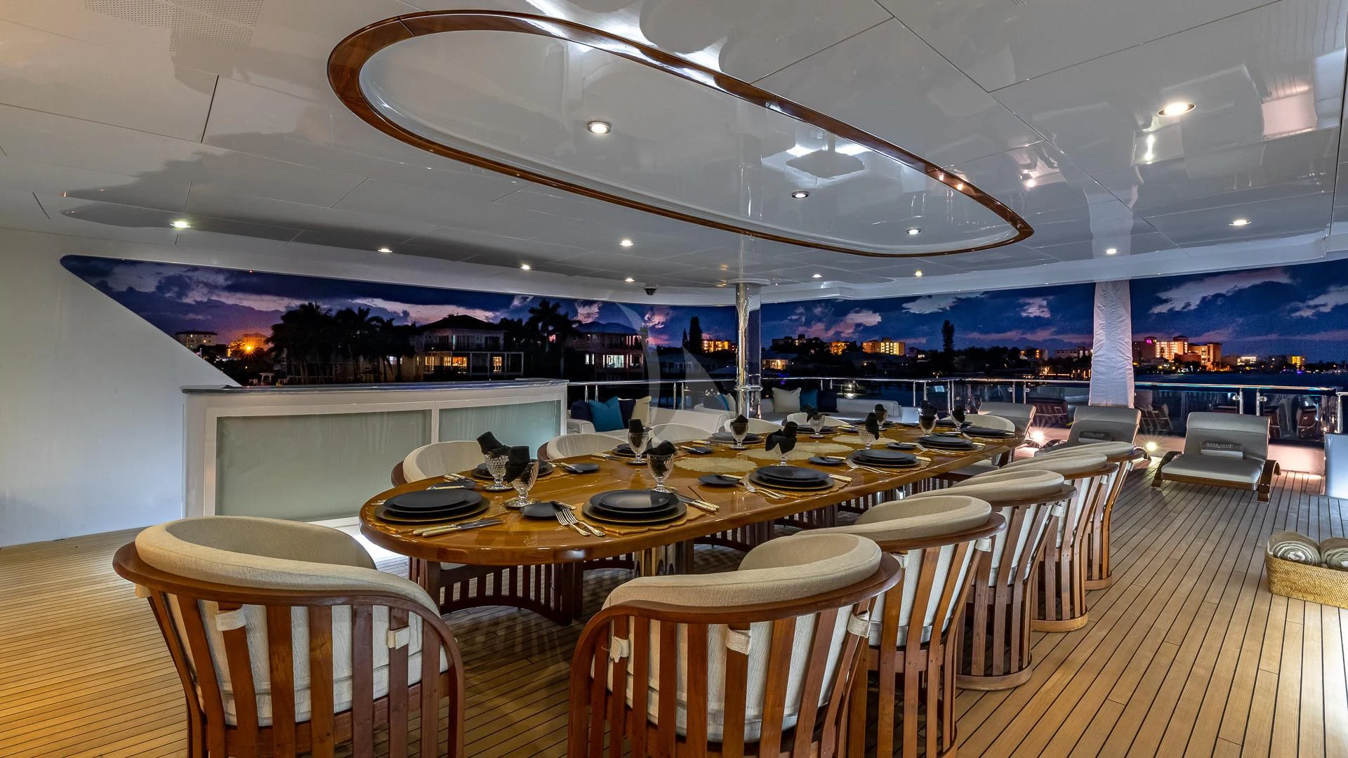 a room with tables and chairs aboard STARSHIP Yacht for Charter