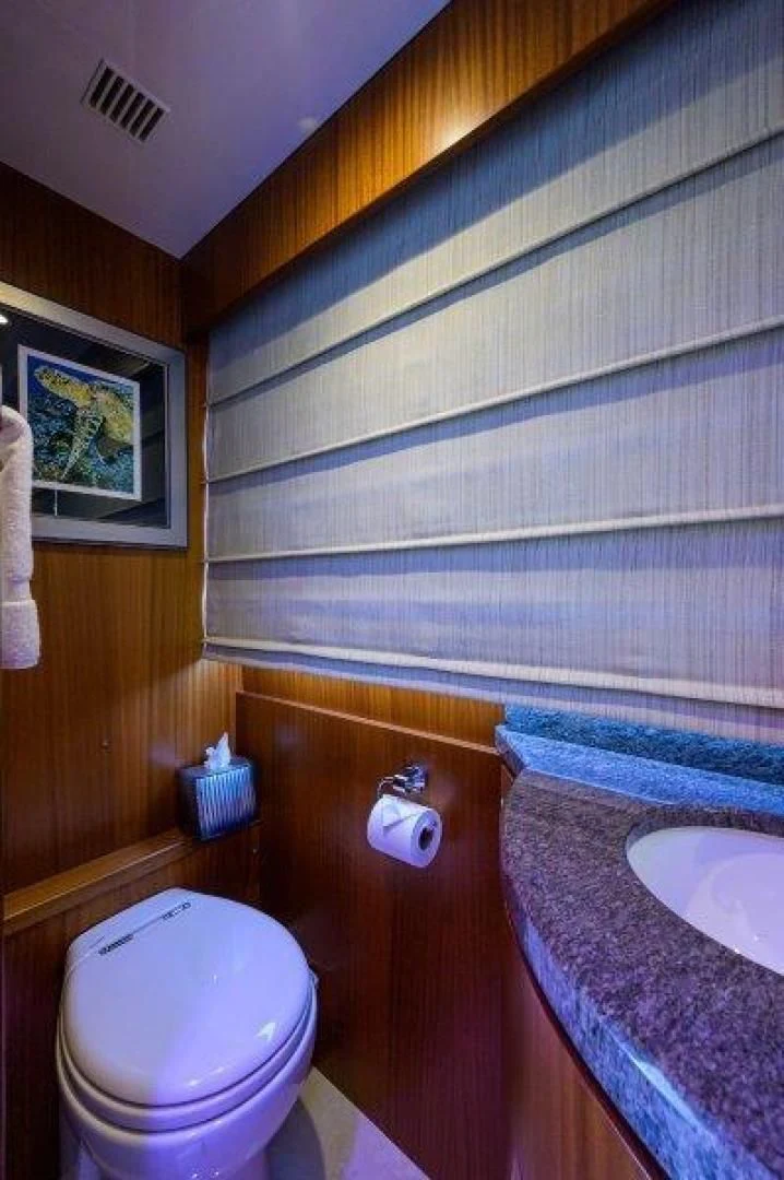 a bathroom with a wood cabinet aboard SOUNDINGS Yacht for Sale