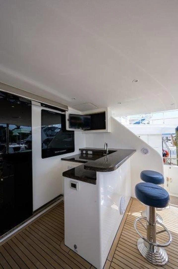 a kitchen with a stool aboard SOUNDINGS Yacht for Sale