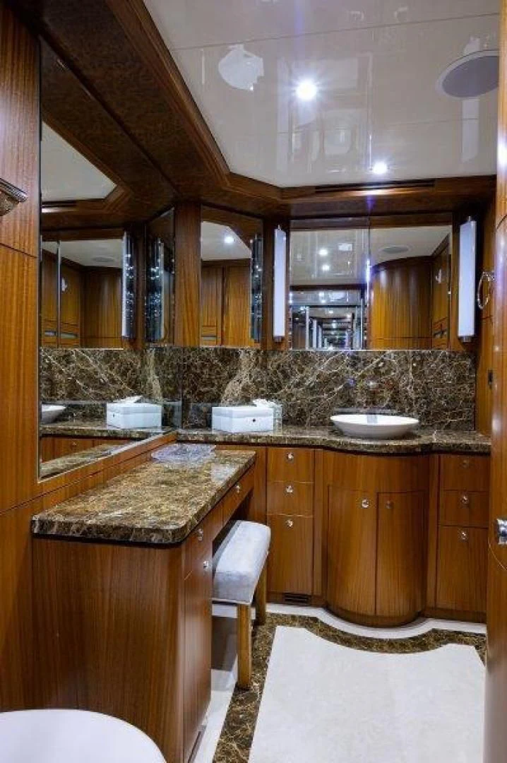 a bathroom with a sink and a mirror aboard SOUNDINGS Yacht for Sale