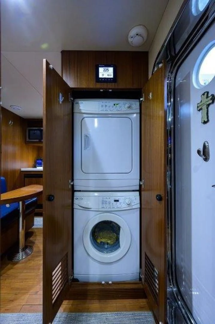 a laundry room with a washing machine aboard SOUNDINGS Yacht for Sale