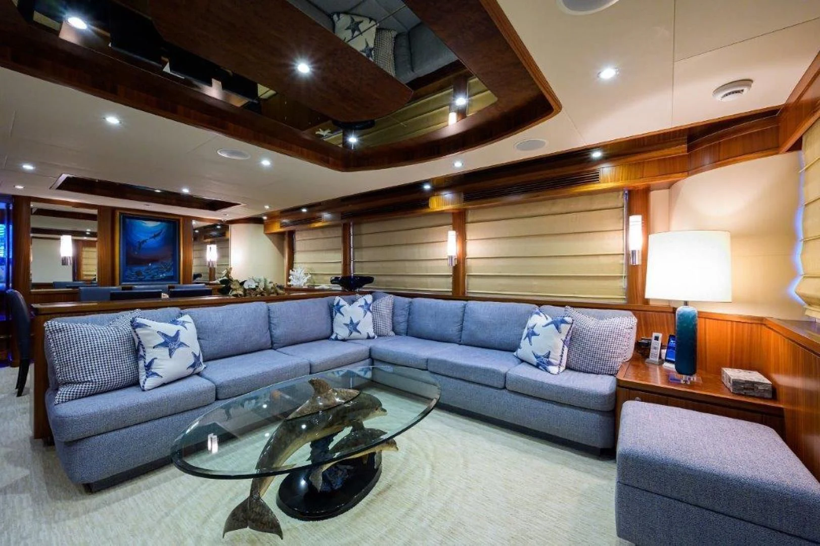 a living room with a large sofa aboard SOUNDINGS Yacht for Sale