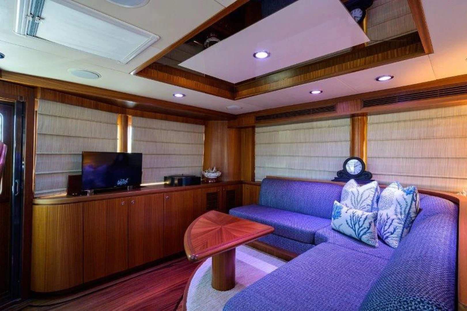 a living room with a couch and a tv aboard SOUNDINGS Yacht for Sale