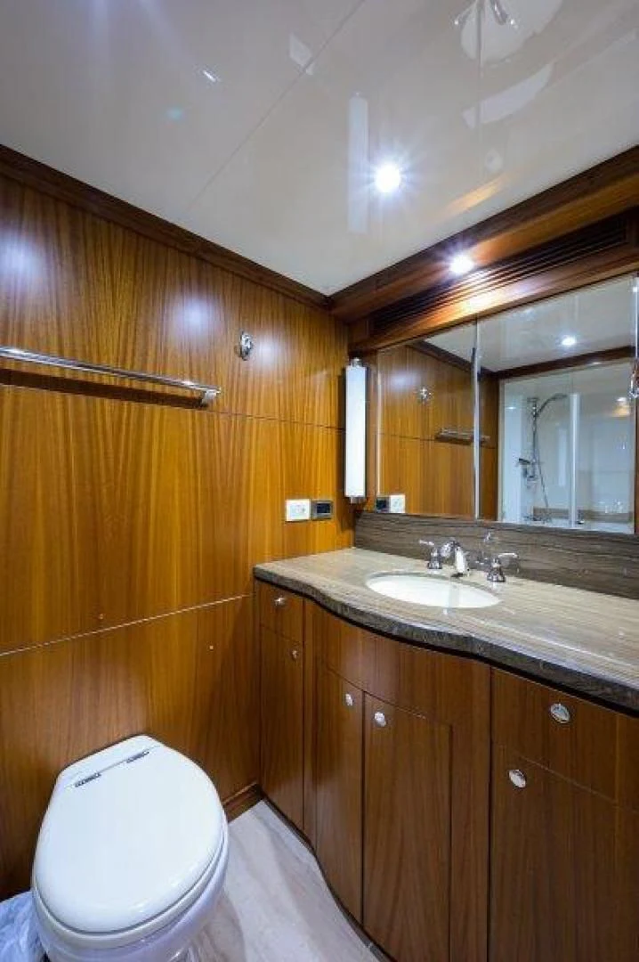 a bathroom with a sink and a toilet aboard SOUNDINGS Yacht for Sale