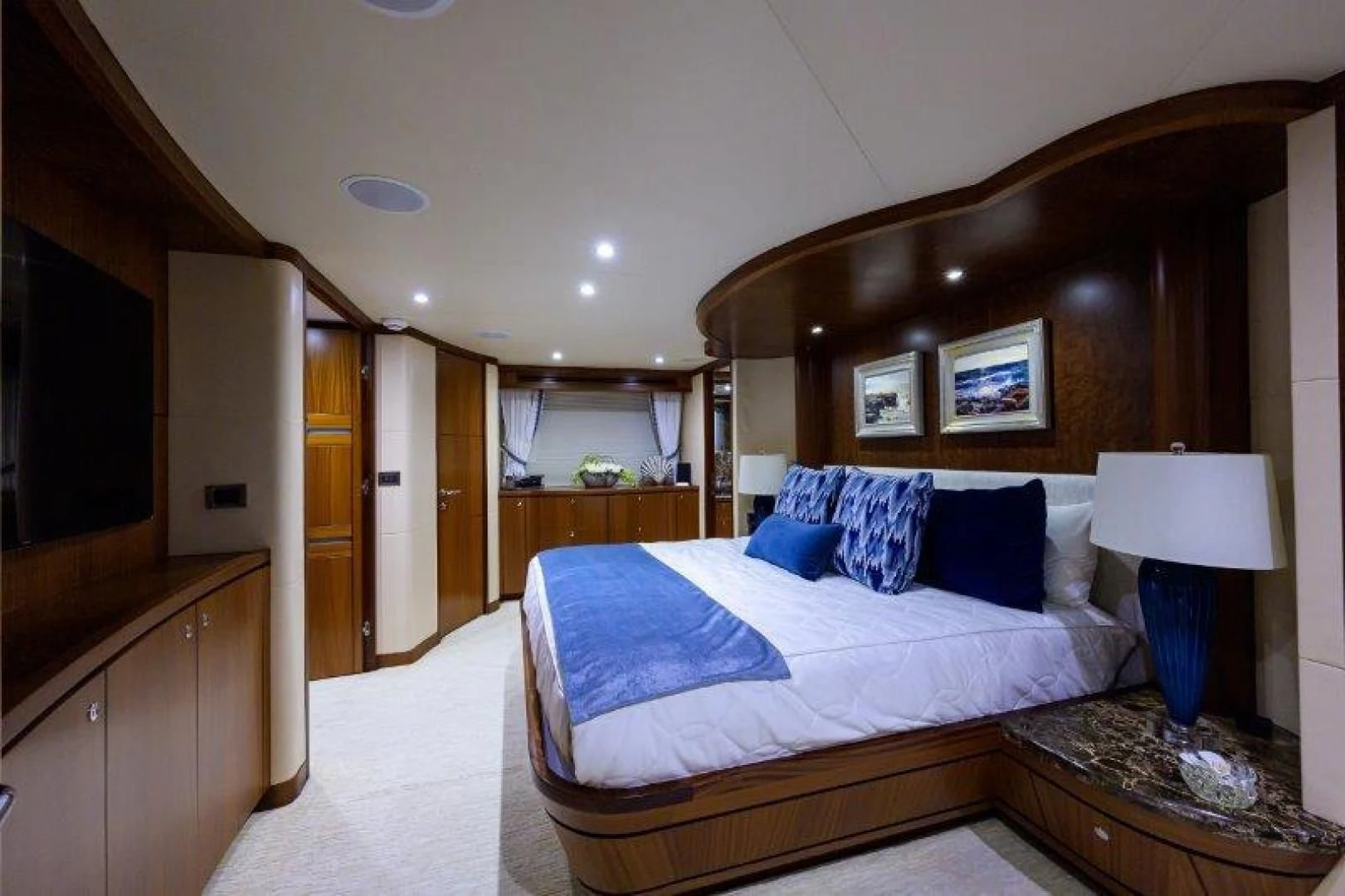 a bedroom with a large bed aboard SOUNDINGS Yacht for Sale