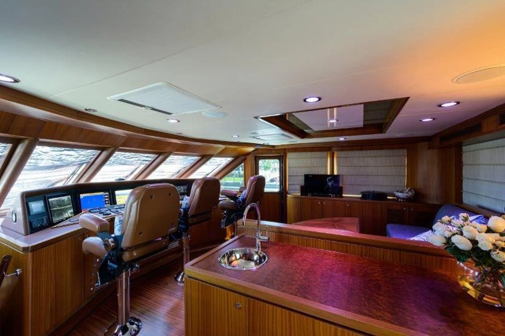 a room with a table and chairs aboard SOUNDINGS Yacht for Sale