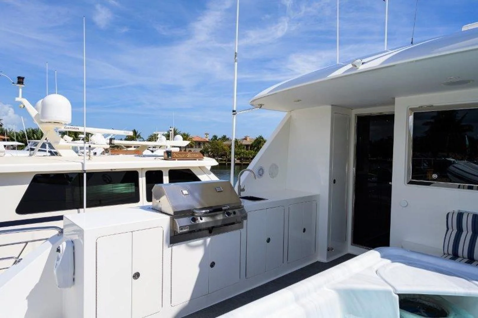 a white car parked outside a building aboard SOUNDINGS Yacht for Sale