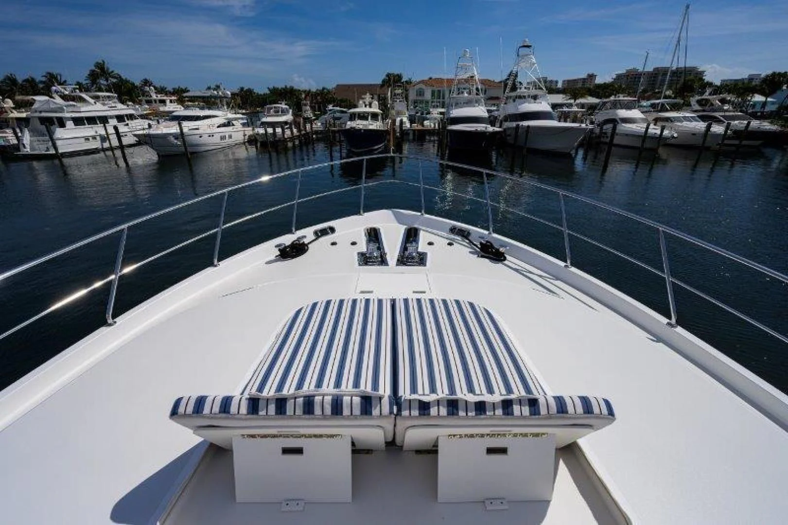 a large pool with a deck and boats in it aboard SOUNDINGS Yacht for Sale