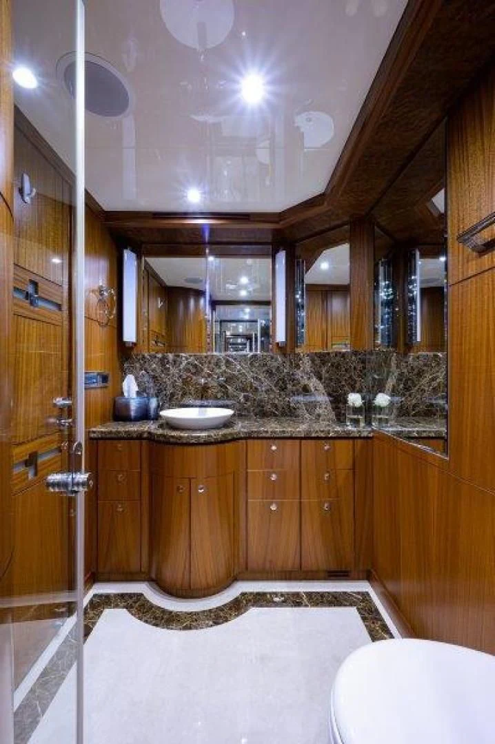 a bathroom with a large mirror aboard SOUNDINGS Yacht for Sale