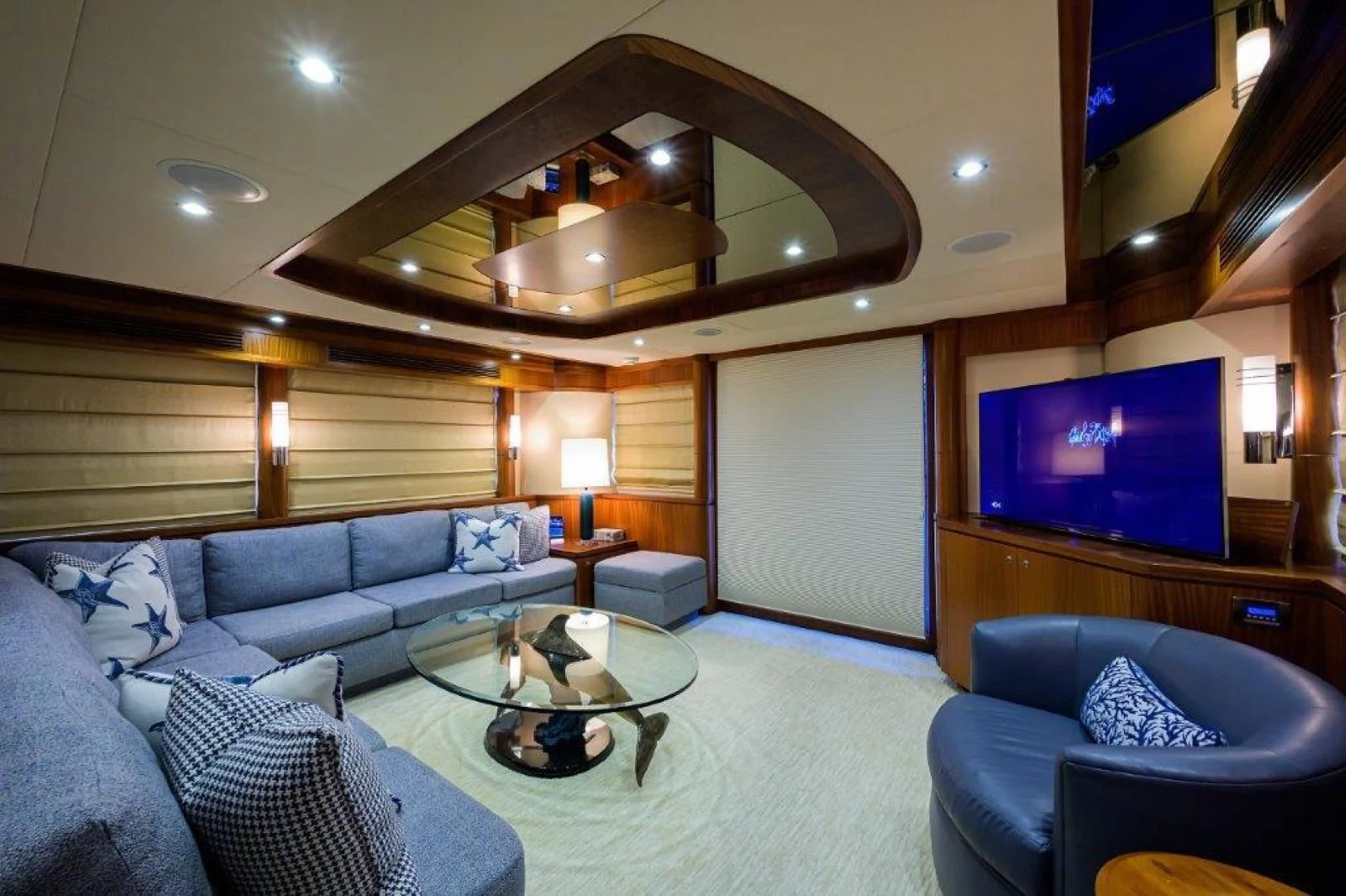 a living room with a large mirror aboard SOUNDINGS Yacht for Sale