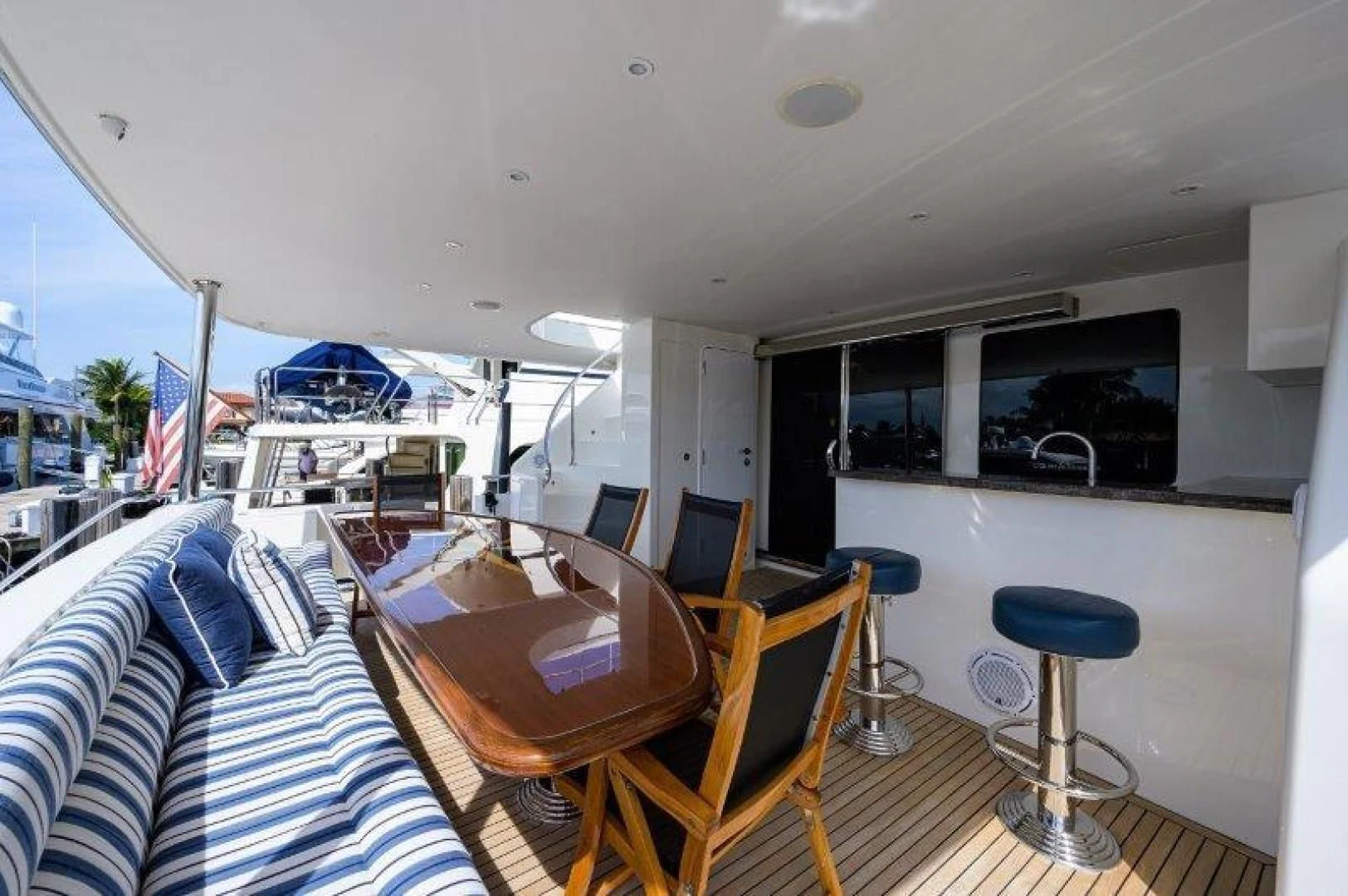 a room with a table and chairs aboard SOUNDINGS Yacht for Sale