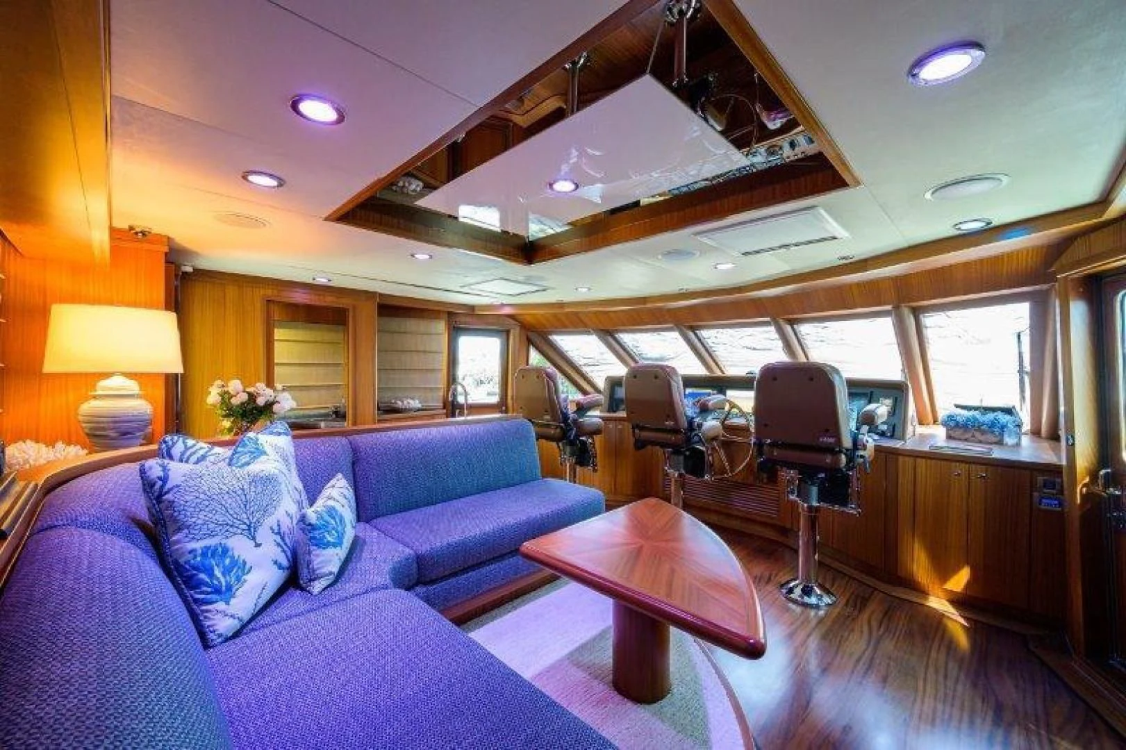 a room with a couch and a table aboard SOUNDINGS Yacht for Sale