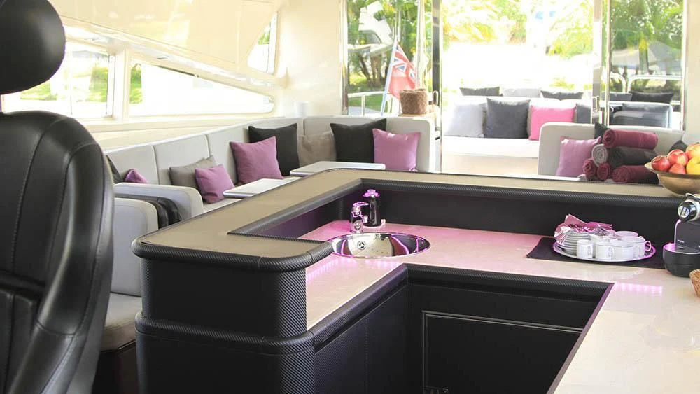 a living room with a couch and a table aboard MYSVEN Yacht for Sale