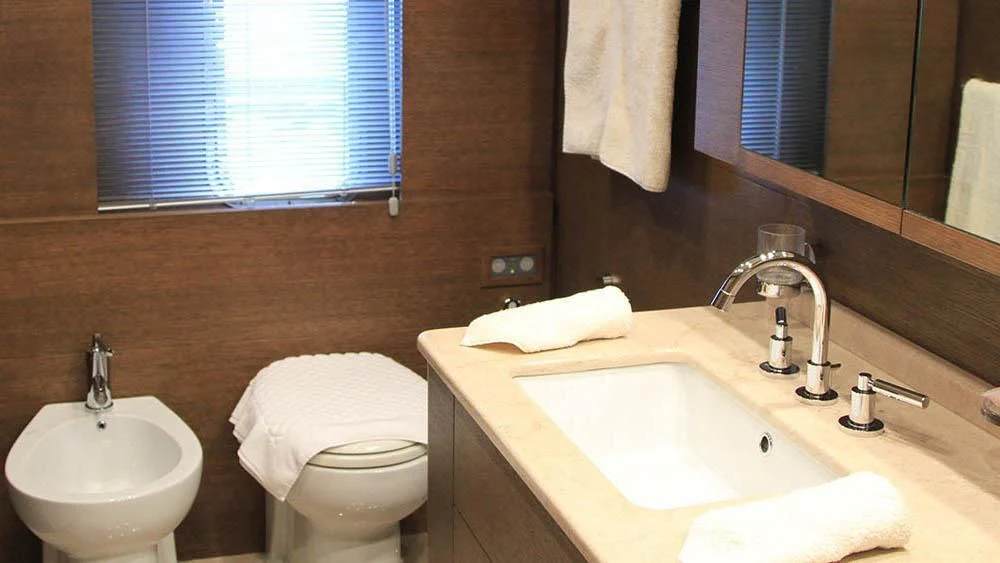 a bathroom with a sink and toilet aboard MYSVEN Yacht for Sale