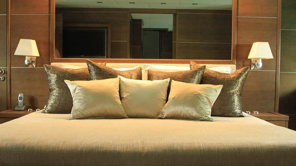 a bed with pillows aboard MYSVEN Yacht for Sale