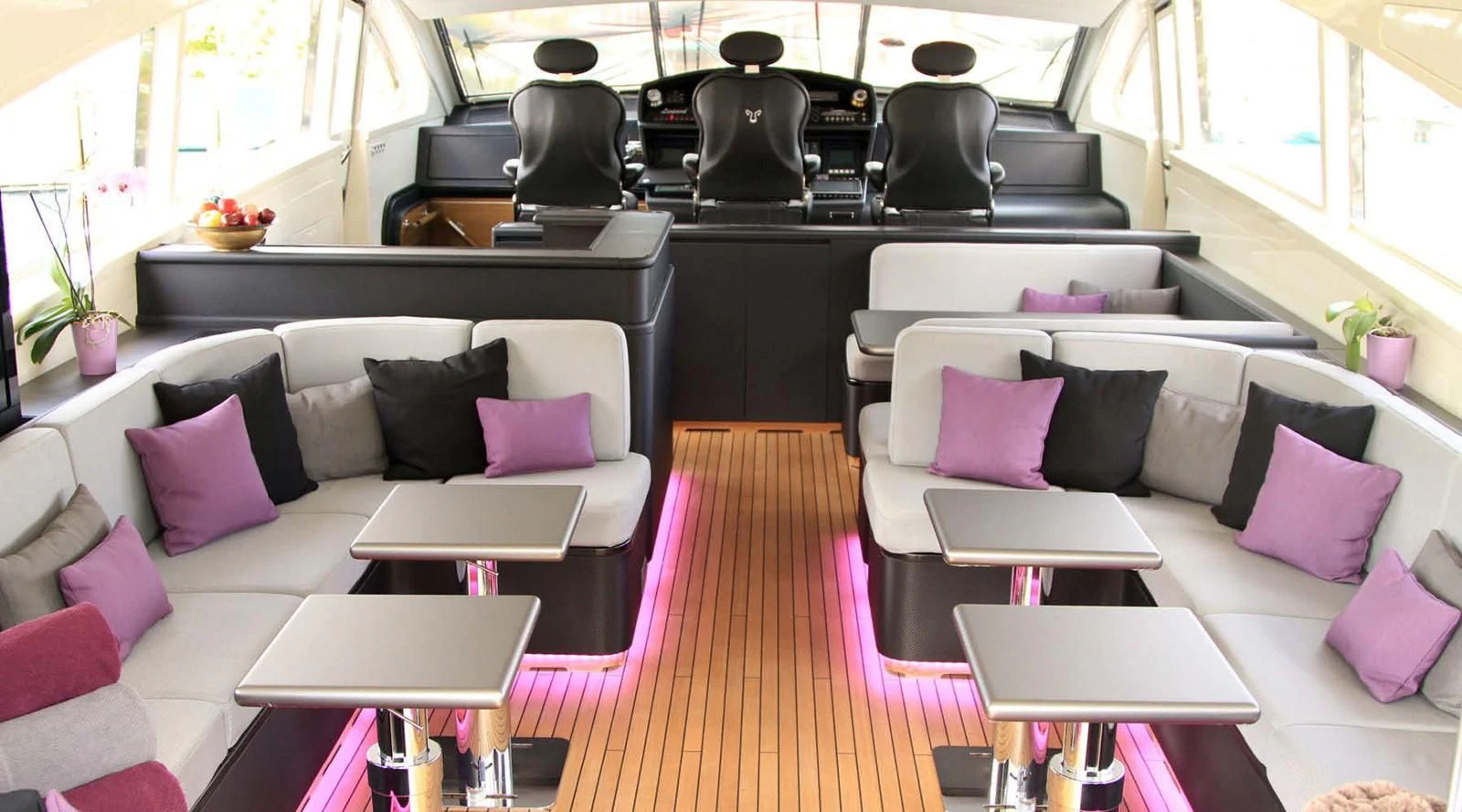 a room with a couch and a table with chairs aboard MYSVEN Yacht for Sale