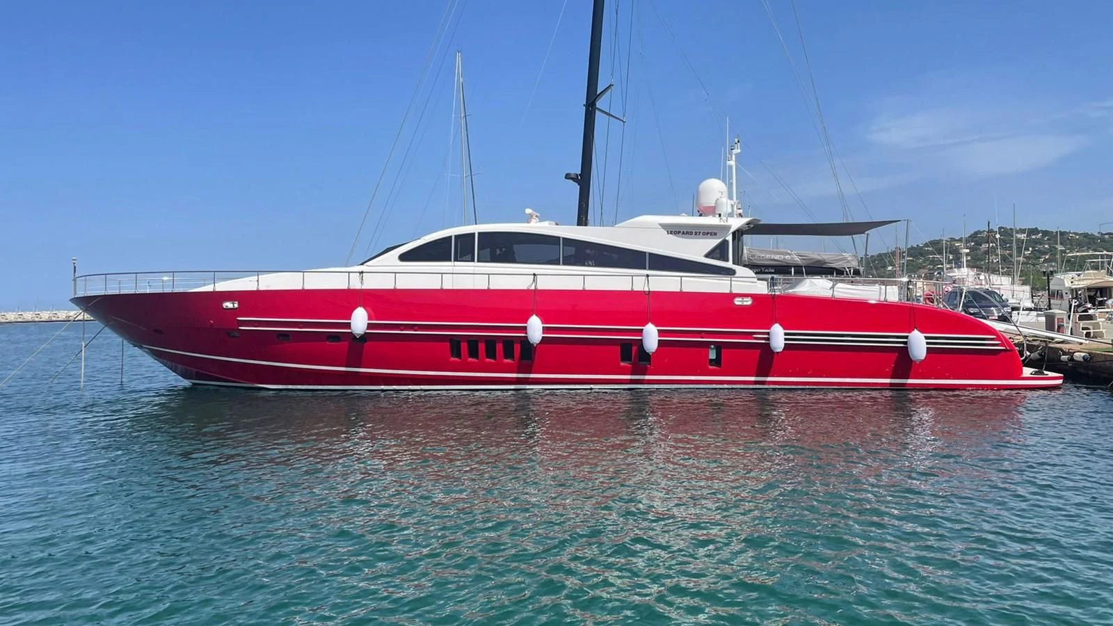 a red and white boat in the water aboard MYSVEN Yacht for Sale