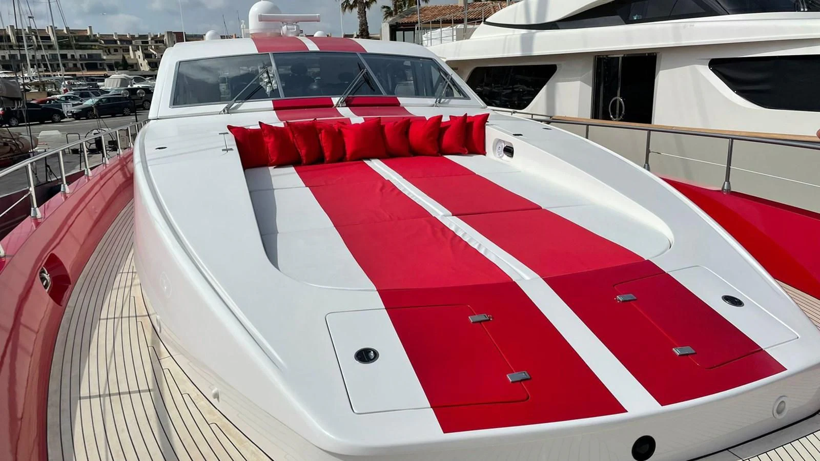a white car with a red stripe aboard MYSVEN Yacht for Sale