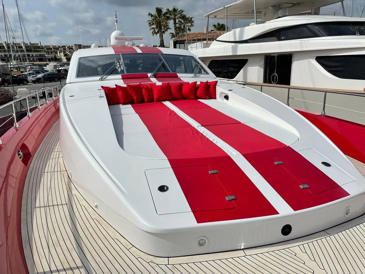a white car with red stripes aboard MYSVEN Yacht for Sale