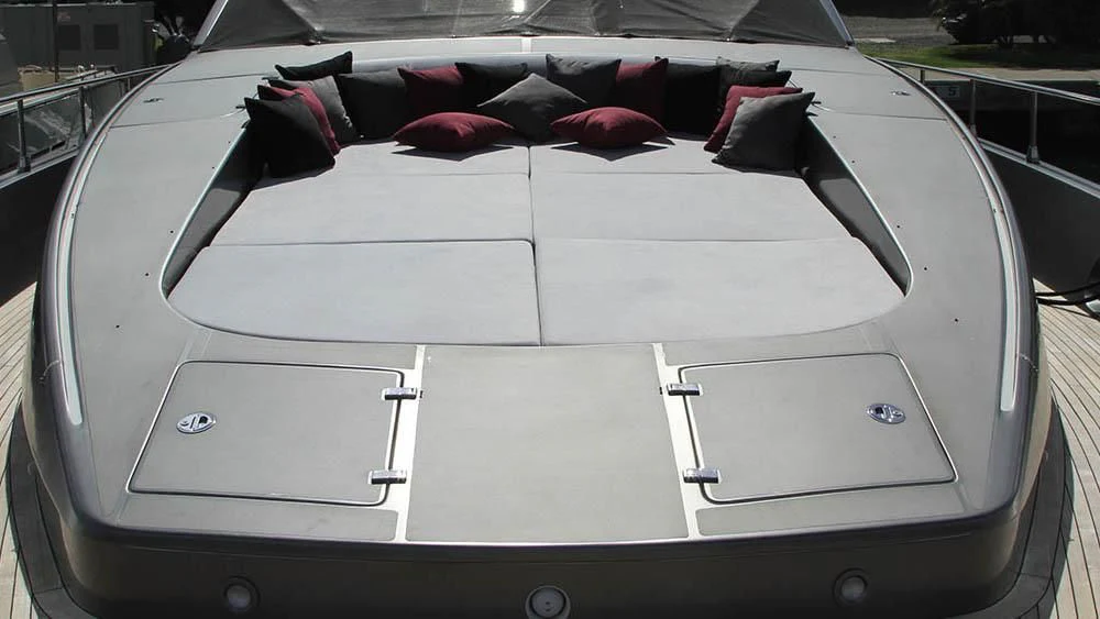 a bed with a black and white bed sheet aboard MYSVEN Yacht for Sale