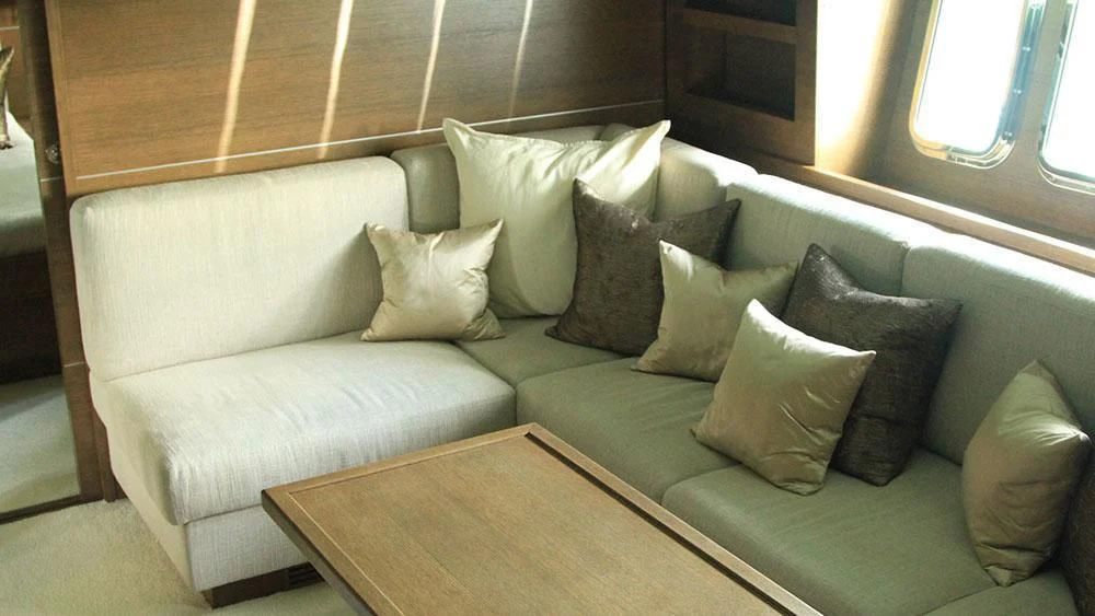 a couch with pillows aboard MYSVEN Yacht for Sale