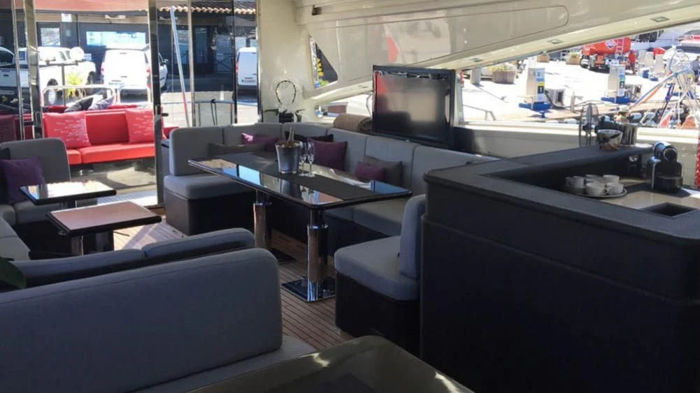 a room with a table and chairs aboard MYSVEN Yacht for Sale