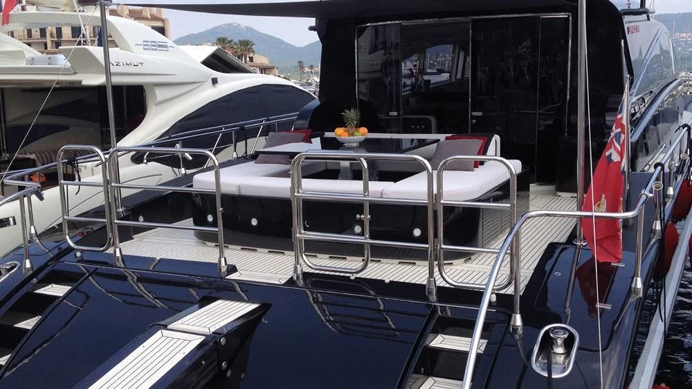 a boat with a flag on the deck aboard MYSVEN Yacht for Sale