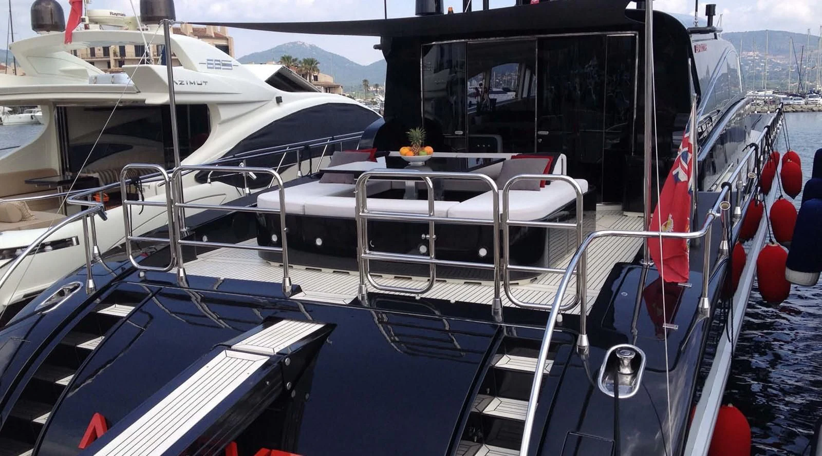 a boat with a flag on the deck aboard MYSVEN Yacht for Sale