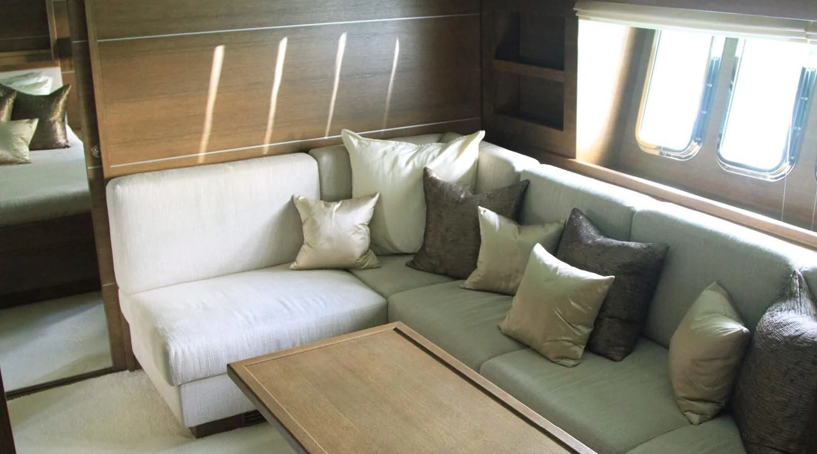 a couch with pillows aboard MYSVEN Yacht for Sale