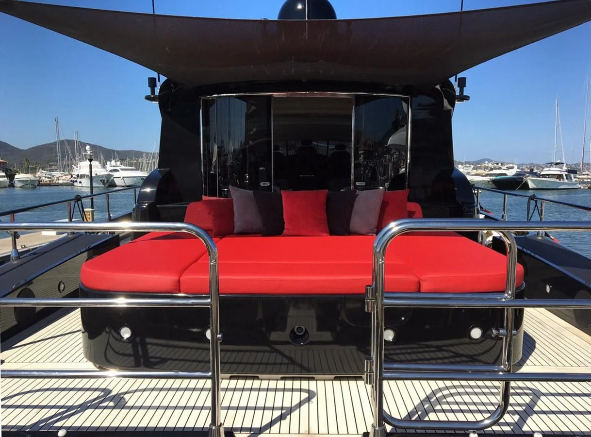 a red and black vehicle with a white stripe on the back aboard MYSVEN Yacht for Sale