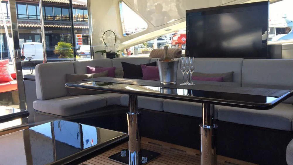 a table with glasses on it aboard MYSVEN Yacht for Sale