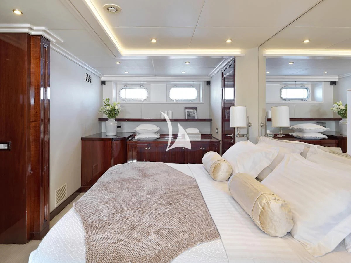 a large bedroom with a bed aboard MIA ZOI Yacht for Charter