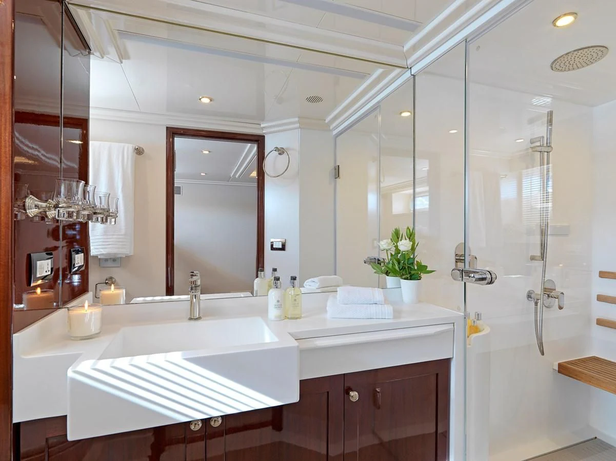 a bathroom with a glass shower aboard MIA ZOI Yacht for Charter