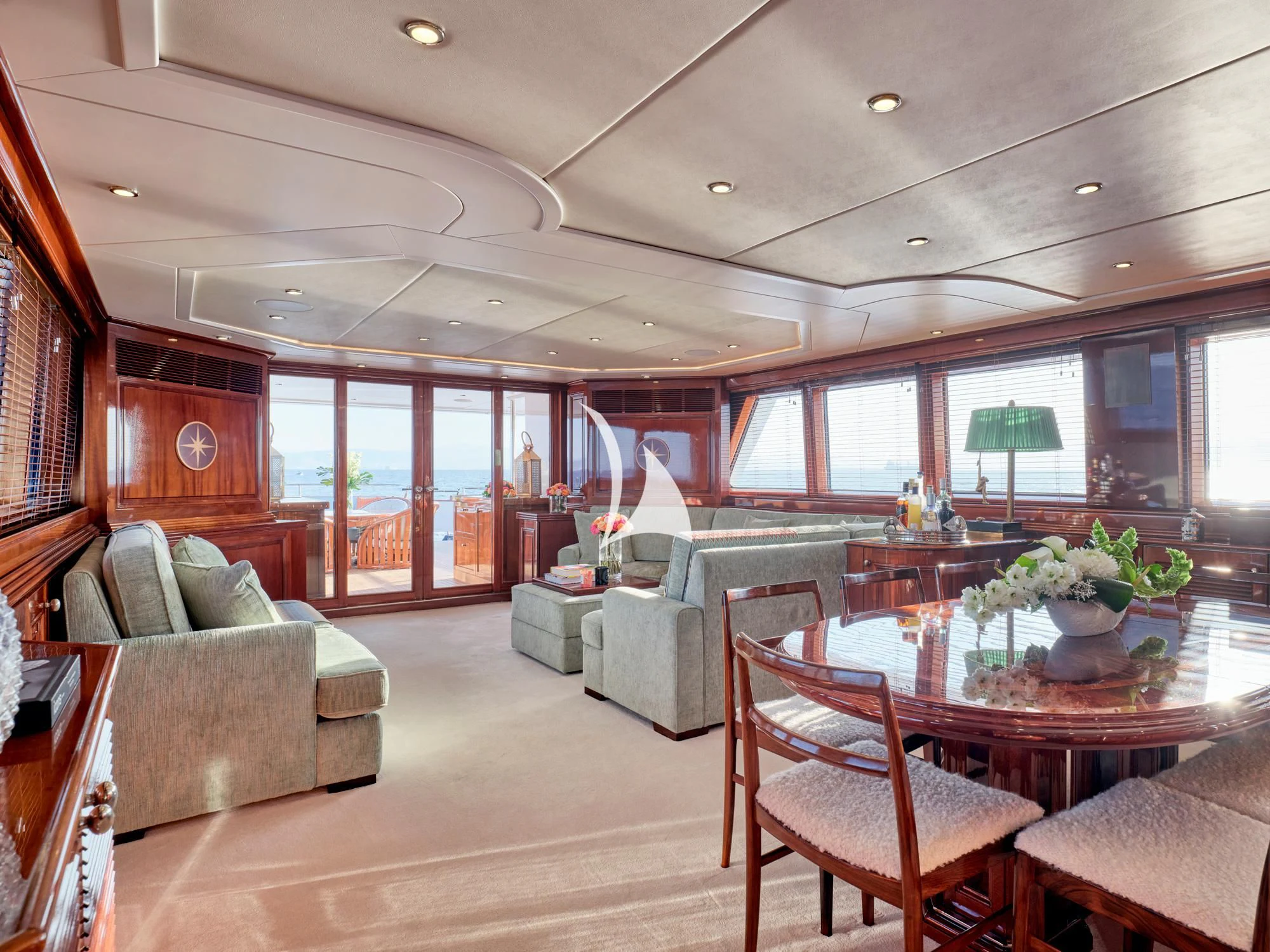 a living room with a table and chairs aboard MIA ZOI Yacht for Charter