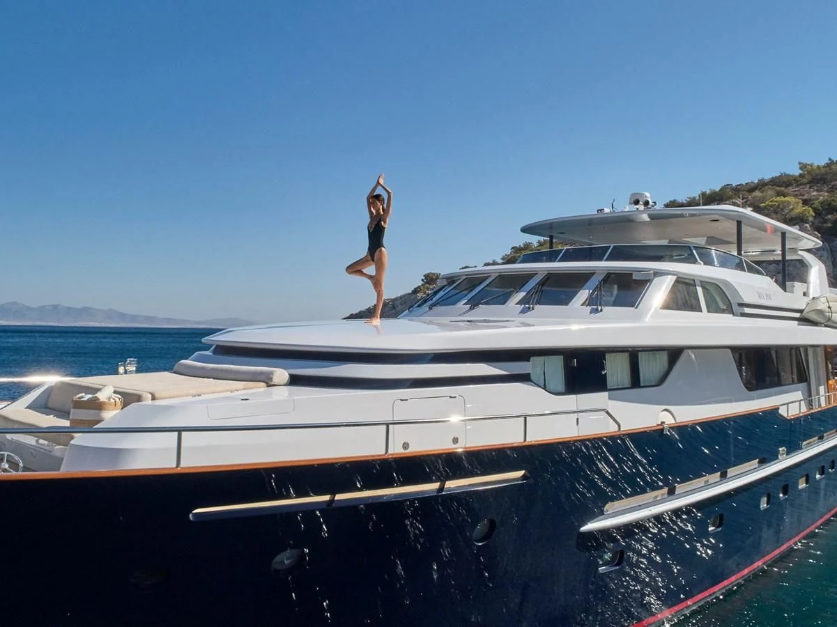 a man standing on a boat aboard MIA ZOI Yacht for Charter