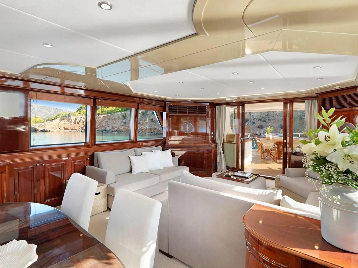 a room with couches and chairs aboard MIA ZOI Yacht for Charter