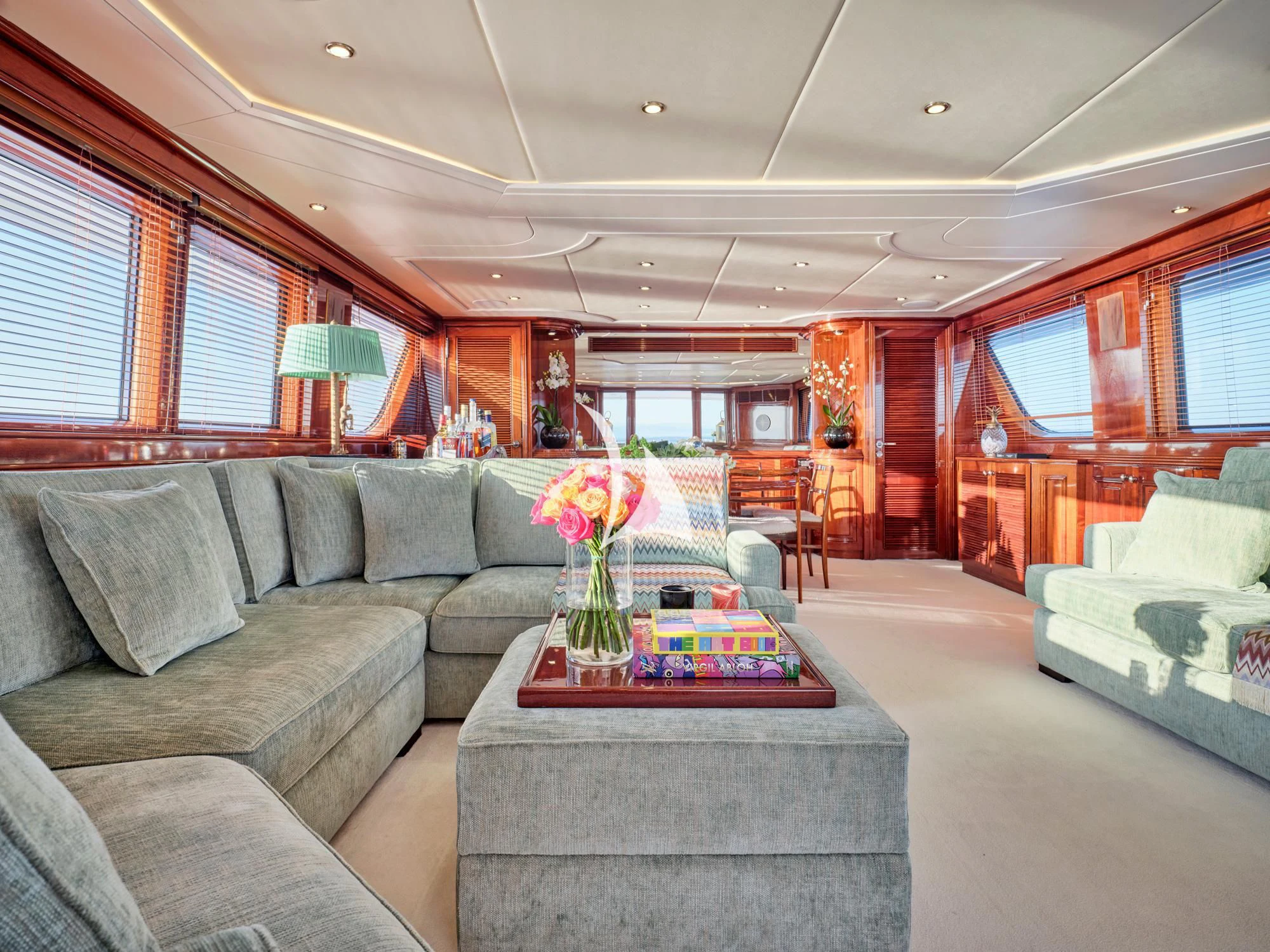 a living room with a table and couches aboard MIA ZOI Yacht for Charter