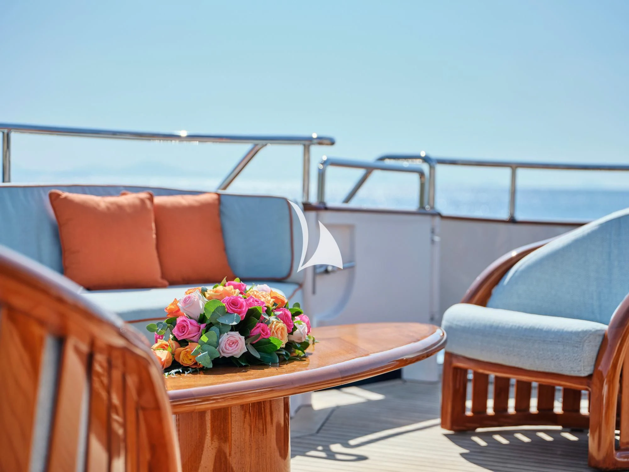 a table with flowers on it aboard MIA ZOI Yacht for Charter