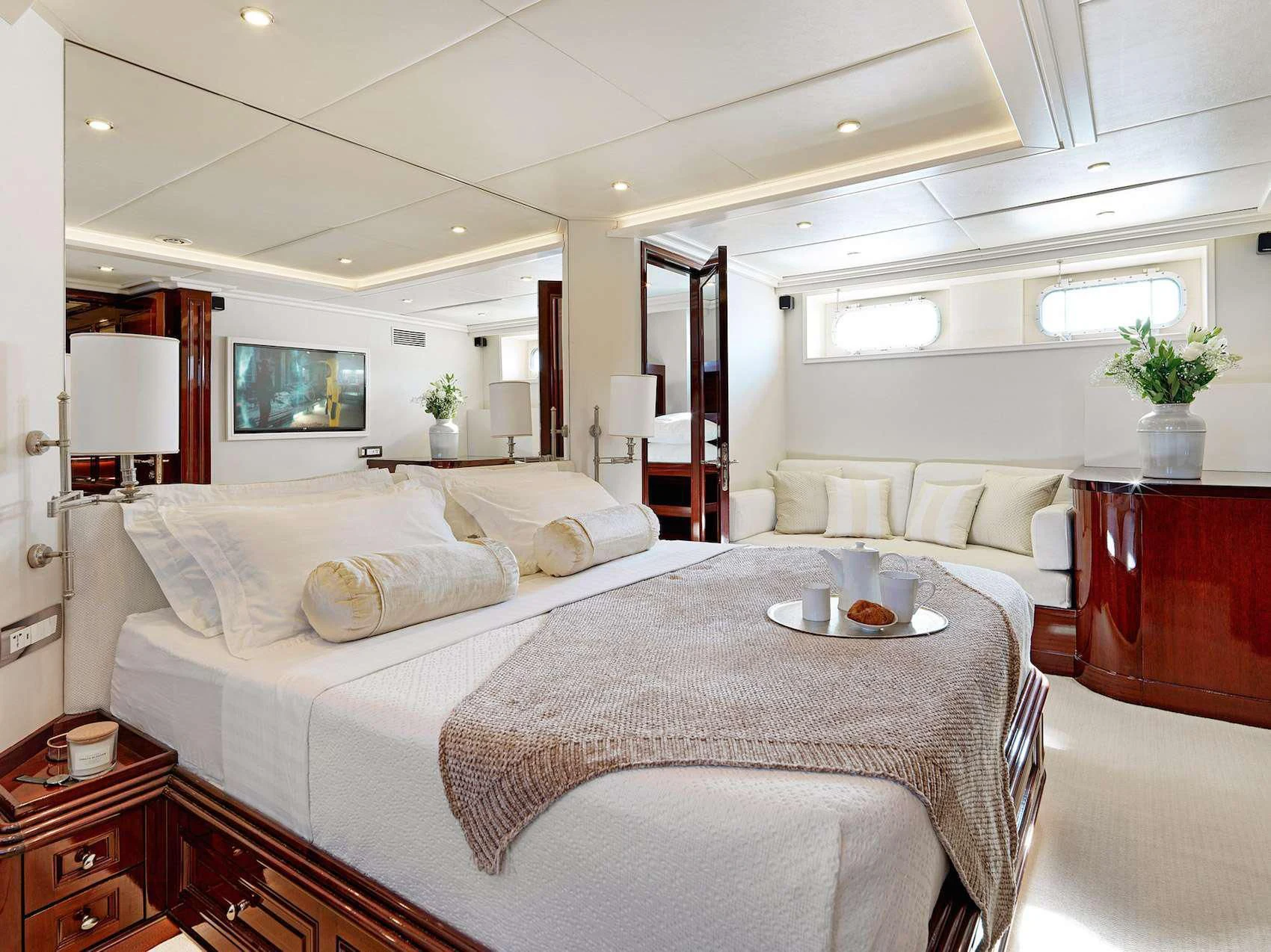 a large white bed in a room aboard MIA ZOI Yacht for Charter