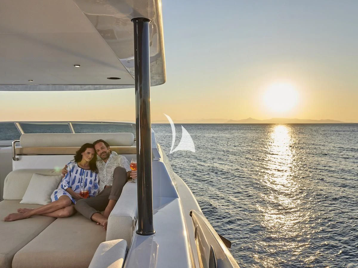 a group of people sitting on a boat aboard MIA ZOI Yacht for Charter