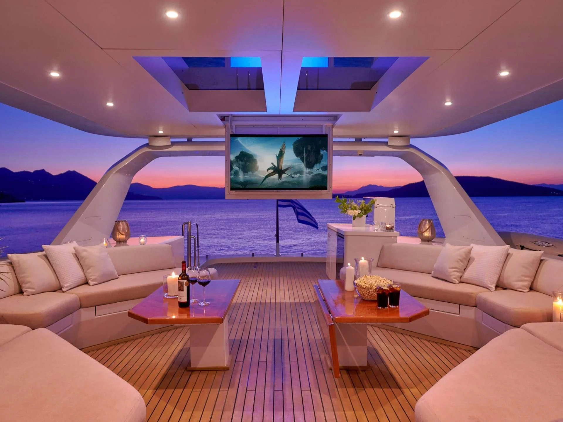 a living room with a large screen aboard MIA ZOI Yacht for Charter