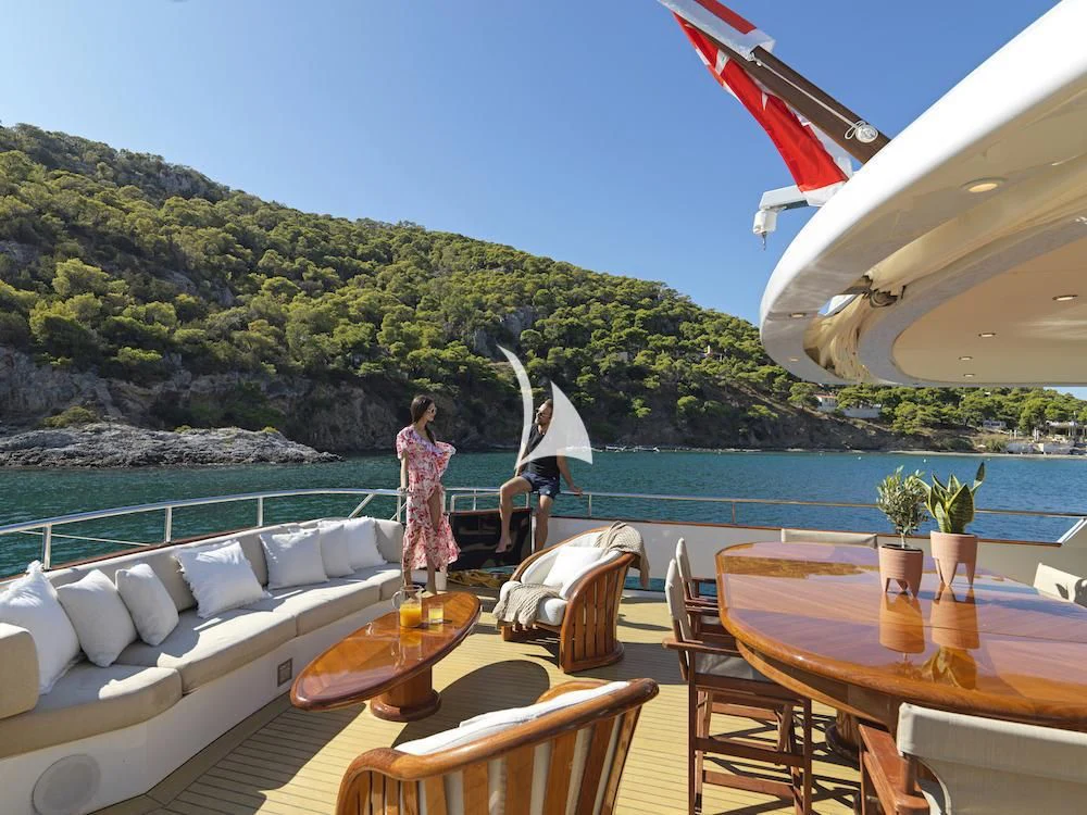 a person sitting on a boat aboard MIA ZOI Yacht for Charter