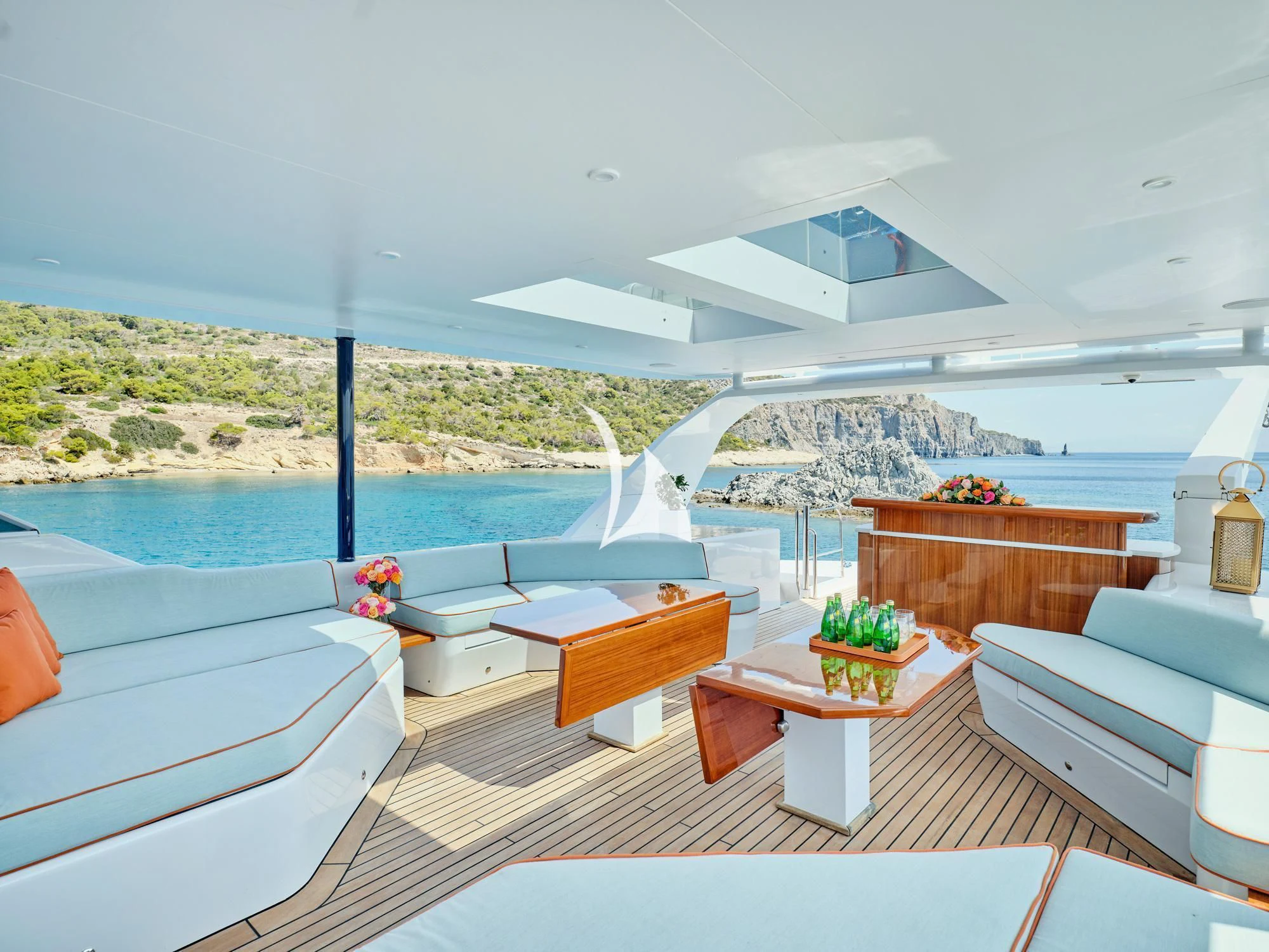 a room with a pool and a view of the water aboard MIA ZOI Yacht for Charter