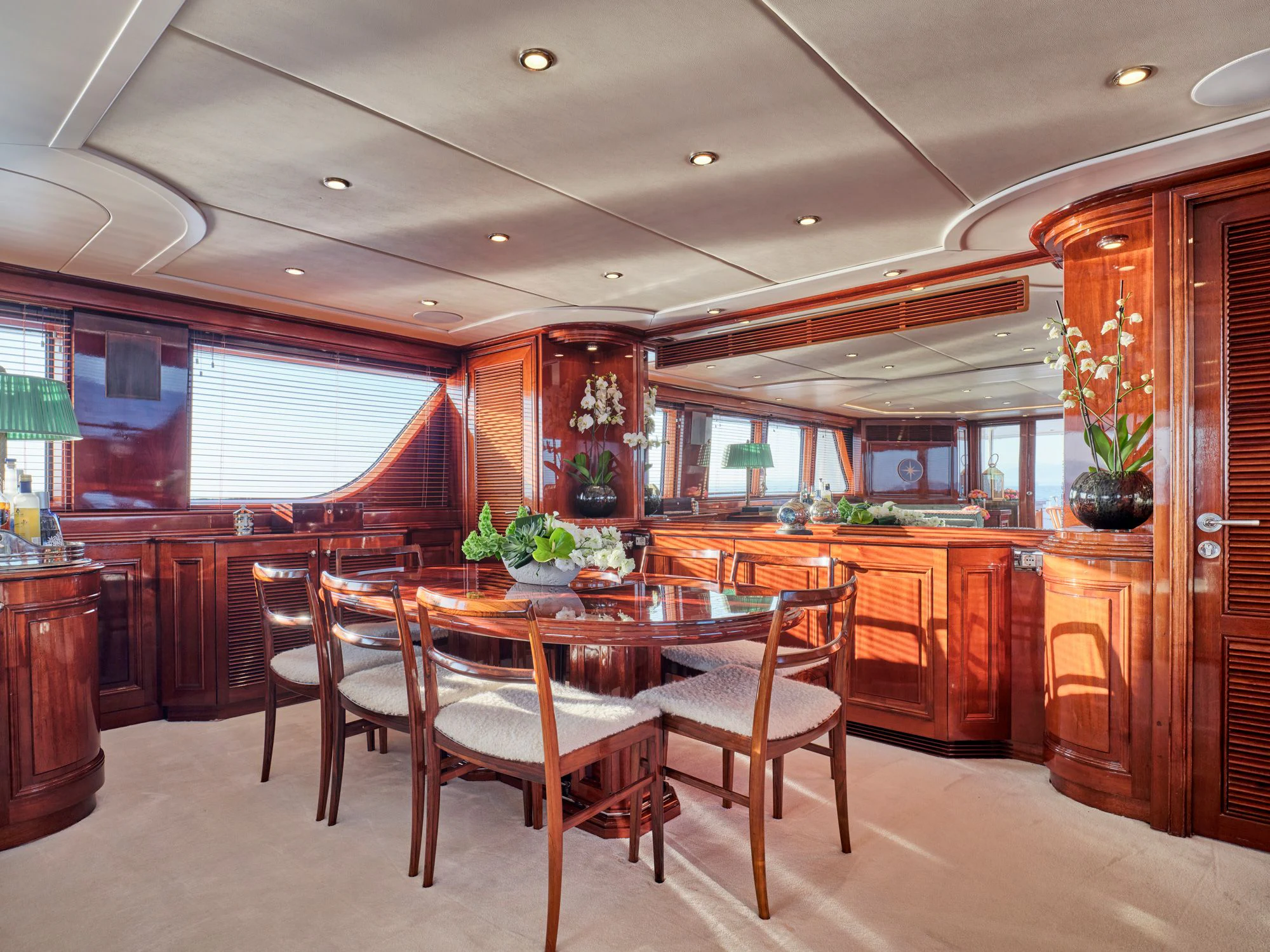 a dining room with a table and chairs aboard MIA ZOI Yacht for Charter
