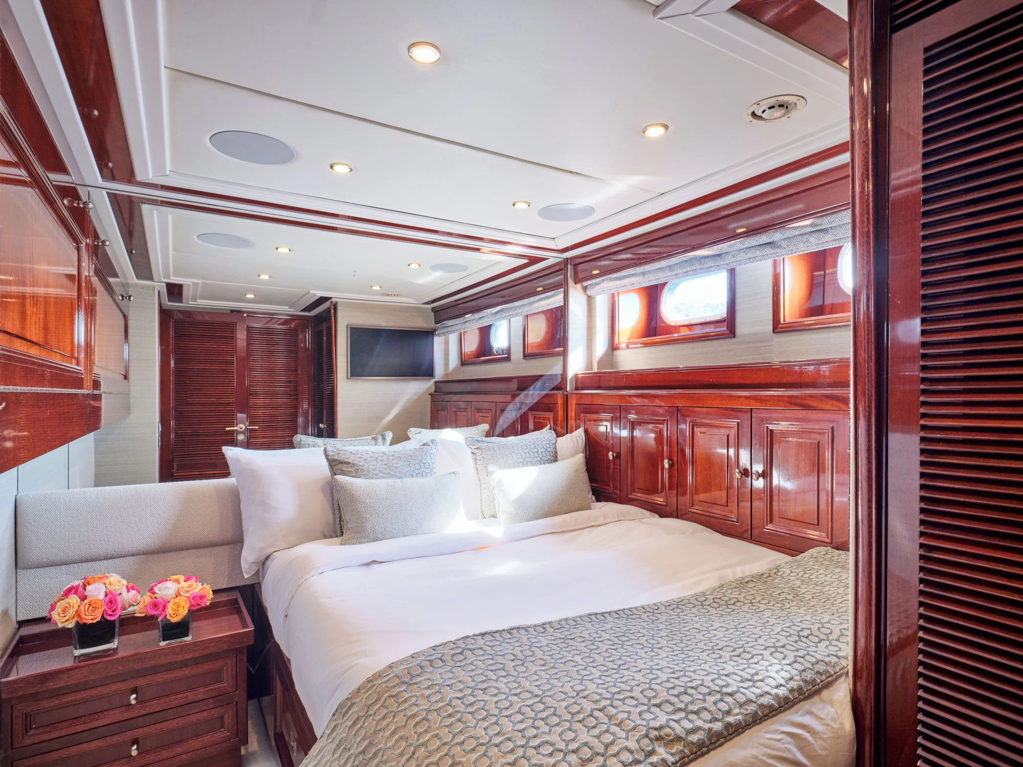 a room with a bed and a window aboard MIA ZOI Yacht for Charter