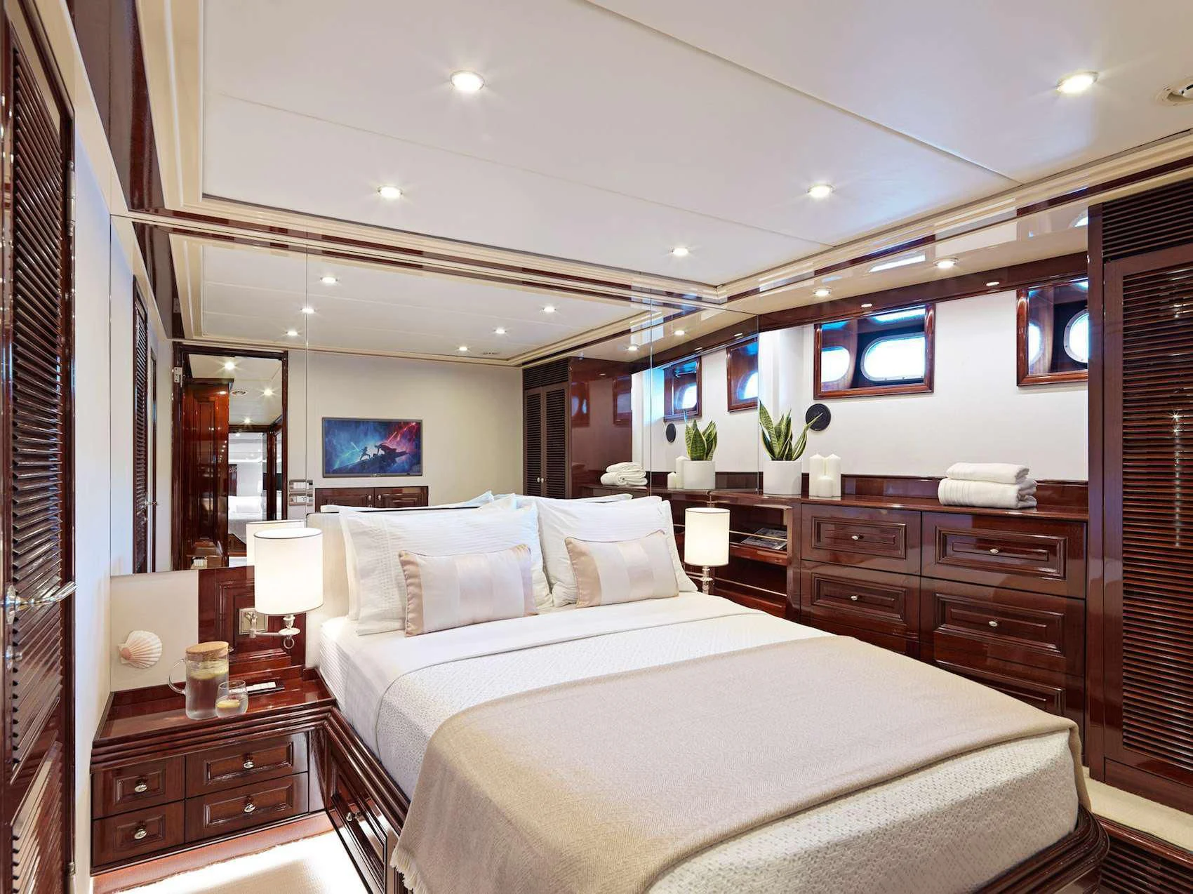 a bedroom with a large bed aboard MIA ZOI Yacht for Charter